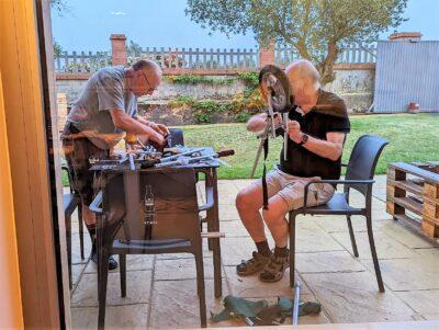 My Camino Day August 24 2022 included watching two men working by a table