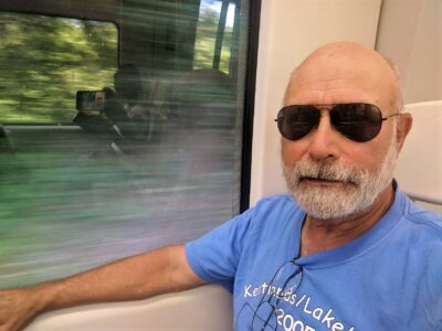 Old man on a train