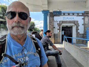 An elderly man waits in the Zumaia train station