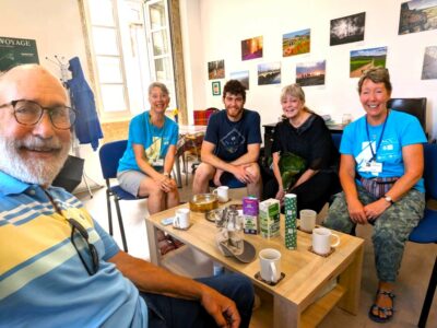 Volunteers welcoming pilgrims at the completion of their Camino.